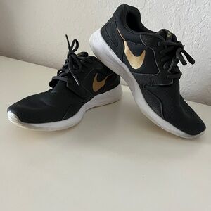 TODAY $10.    Nike Women's Dark Gray and Gold Sneakers